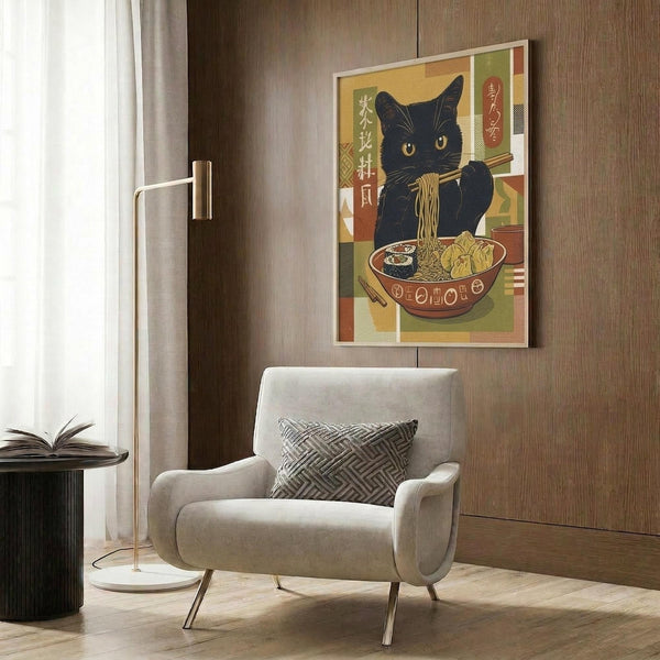 May include: Framed poster showing black cat with yellow eyes eating ramen noodles from decorated bowl, Japanese text and colorful geometric background in vintage style. Modern living room setting with beige armchair, brass floor lamp, dark wood paneled wall, and patterned throw pillow.
