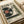 May include: Vintage-style poster featuring a turntable with vinyl record on cream-colored paper, displayed on white bedding. The retro advertisement design shows Japanese text at top, detailed turntable illustration with red vinyl record, and technical specifications at bottom. Warm beige and green color palette with classic Hi-Fi stereo branding elements.