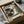 May include: Vintage-style poster print featuring a turntable with vinyl record in cream, black and muted green tones with Japanese text, displayed in black frame inside cardboard shipping box with protective tissue paper wrapping