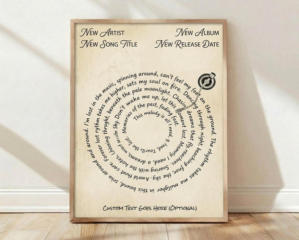 May include: Framed poster print in natural wood frame leaning against white wall on light wooden floor. Cream-colored background with black text in elegant script font at top showing placeholder fields for artist, song title, album and release date. Center features curved text arranged in spiral pattern with song lyrics, alongside small vinyl record icon. Bottom has space for custom text. Soft natural lighting creates gentle shadows.