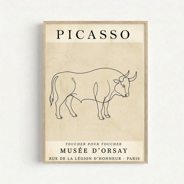 May include: Framed poster print hanging on white wall featuring minimalist line drawing of a bull in black ink on cream-colored paper. Simple continuous line art shows bull in profile with horns, four legs, and tail. Text reads "PICASSO" at top and "MUSÉE D'ORSAY" with French museum information below. Natural wood frame surrounds the vintage-style exhibition poster with clean, modernist aesthetic.
