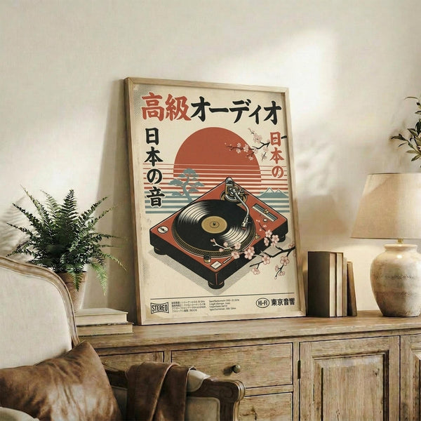 May include: Framed vintage-style poster featuring red turntable with vinyl record against orange sunset with cherry blossoms and Japanese text, displayed on rustic wooden sideboard alongside fern plant, ceramic vase, and books in cozy living room with beige chair and neutral walls