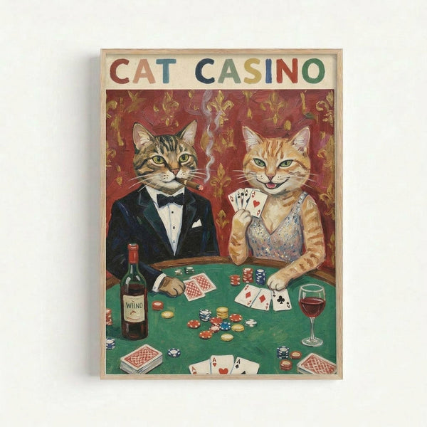 Vintage-style poster featuring two cats dressed as casino players at a green poker table. The tabby cat wears a black tuxedo with bow tie and holds a cigar, while the orange cat wears a sparkly dress and holds playing cards. Red ornate wallpaper background with poker chips, wine bottle, glass, and scattered cards on the felt table. Framed in light wood against white wall.