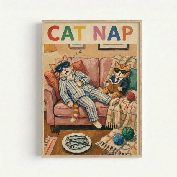 Framed poster artwork showing two anthropomorphic cats in a cozy living room scene. One orange tabby cat in blue striped pajamas sleeps on a pink armchair with "zzz" symbols above, while another cat in sunglasses and formal attire sits reading nearby. The room includes a coffee table with fish on a plate, colorful yarn balls on a striped rug, and warm lighting. "CAT NAP" appears in colorful block letters at the top. The illustration has a whimsical, vintage storybook style with rich eart