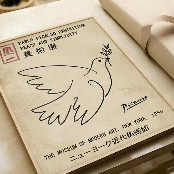 Minimalist line drawing of a dove holding an olive branch in its beak, rendered in simple black lines on aged cream paper. The artwork features Picasso's signature below the dove and text reading "PABLO PICASSO EXHIBITION: PEACE AND SIMPLICITY" with Chinese characters, "THE MUSEUM OF MODERN ART, NEW YORK, 1950" and a red stamp in the corner. The poster is photographed laying flat on white paper with neutral lighting.