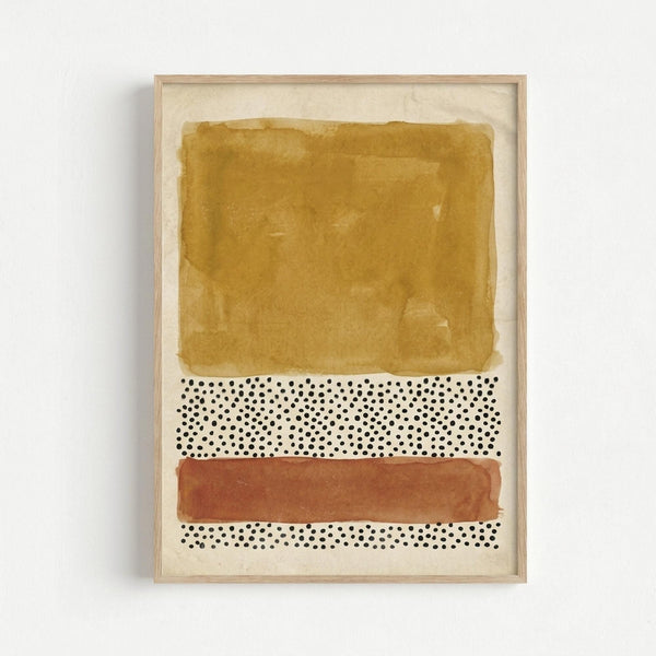 Framed abstract art print with horizontal bands of golden ochre watercolor wash at top, scattered black dots on white background in middle, terracotta orange brushstroke below, and more dotted pattern at bottom, displayed in light wood frame against white wall.