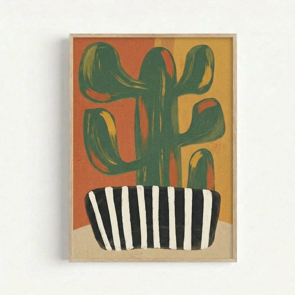 A framed art print showing a stylized green cactus with multiple curved arms growing from a black and white striped pot. The background features warm gradient colors transitioning from orange on the left to golden yellow on the right. The cactus is rendered in deep green with subtle texture details and curved, organic shapes. The pot sits on a light beige surface, and the artwork is displayed in a thin natural wood frame against a white wall.