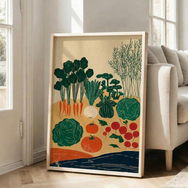 May include: Framed botanical poster featuring illustrated vegetables in green, orange, and red colors against cream background with blue accent at bottom. Shows carrots, cabbages, tomatoes, radishes, and leafy greens in vintage-inspired flat design style. Light wood frame leaning against white wall next to beige upholstered chair in bright, airy living room with large windows.