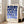 May include: Framed geometric poster with blue circles and semicircles arranged in a grid pattern on cream background, displayed in bright living room next to beige sofa. Natural wood frame, sunlight streaming through white windows onto hardwood floors.