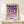 May include: Framed geometric art print with purple and lavender circles arranged in a grid pattern on cream background, displayed on light wood console table next to small wrapped gift with natural twine and greenery sprig against white wall