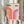 May include: Hands holding a framed geometric poster with "BAUHAUS 1923" text and two gradient arches - one orange-red on left, one magenta-pink on right, displayed against neutral curtains with dried pampas grass visible on left side