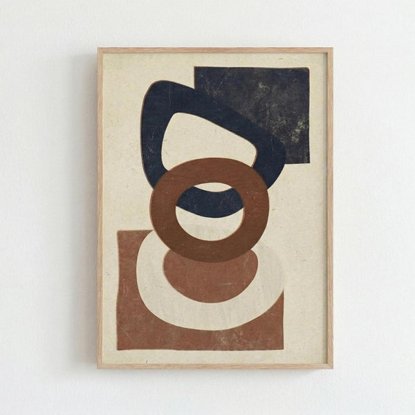 Abstract artwork featuring overlapping geometric shapes in navy blue, terracotta brown, and cream colors on textured paper background. The composition includes circular, curved, and rectangular forms that intersect and layer over each other. Displayed in a simple light wood frame against a white wall.