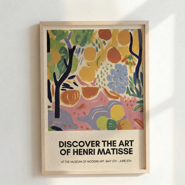 May include: Framed art poster displayed on white wall in light wooden frame. Colorful abstract painting features vibrant fruits, flowers, and foliage in Fauve style with bold yellows, oranges, greens, blues and pinks. Black tree branches frame organic shapes and botanical elements. White text below reads "DISCOVER THE ART OF HENRI MATISSE" with museum exhibition details in smaller print.