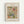 May include: Framed botanical art print displayed on white wall. Features William Morris's ornate floral pattern with flowing vines, stylized flowers and leaves in coral pink, sage green, dusty blue and cream colors. Light wood frame surrounds cream matting with vintage-style typography. Decorative Arts and Crafts movement design with intricate curving stems and blooms.