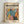 May include: Framed poster with colorful tropical leaf cutout design in Matisse style, featuring overlapping monstera and palm leaves in teal, orange, pink, yellow and black. Light wood frame displayed against white wall. Text at top reads "Mar 1 - May 25 10:00 AM - 2:30 PM Weekend Art Retreat Saturdays" and "modernist" below artist name. Bottom text says "Embracing Colorful Freedom In the Spirit of Matisse."
