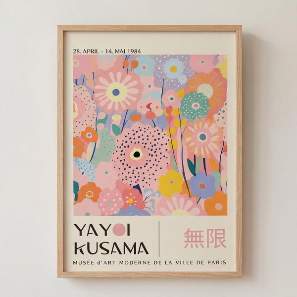 May include: Framed vintage-style exhibition poster featuring colorful abstract floral pattern with pastel pink, blue, yellow, and orange blooms, polka dots, and organic shapes. Light wood frame against cream wall. Text shows dates "28. APRIL - 14. MAI 1984" and artist name "YAYOI KUSAMA" with Japanese characters and "MUSÉE d'ART MODERNE DE LA VILLE DE PARIS" below the artwork.