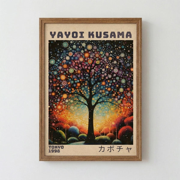 May include: Framed art print displayed on white wall showing a stylized tree with colorful dotted foliage against a vibrant sunset sky. The artwork features Kusama's signature polka dot style with circles in blues, oranges, purples, and greens creating the tree's canopy. The landscape below shows rolling hills in warm autumn tones. Text reads "YAYOI KUSAMA" at top, "TOKYO 1998" at bottom left, and Japanese characters at bottom right. Natural wood frame with cream matting.