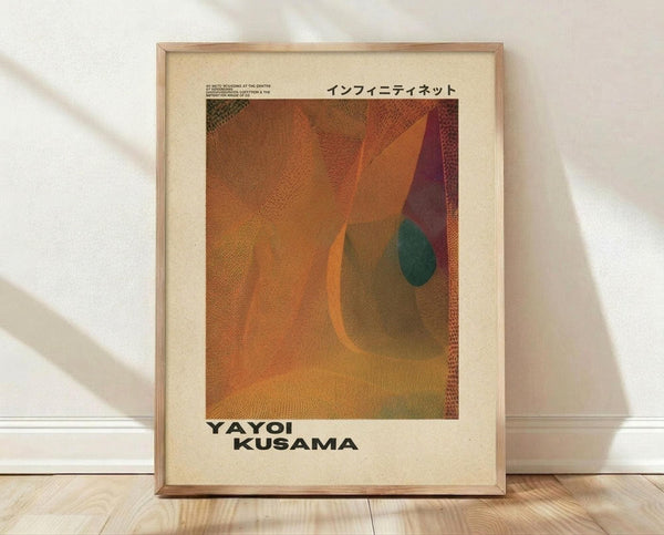 May include: Framed art print leaning against white wall on wooden floor. Poster features abstract composition with flowing orange, burgundy, and teal curved shapes on dotted textured background. Japanese text at top, artist name at bottom. Light wooden frame with cream matting. Natural lighting creates soft shadows on wall.