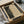 May include: Framed art print featuring a dotted halftone portrait in black and cream tones, displayed in wooden box packaging with protective wrapping. The artwork shows a face rendered in varying sized dots that create depth and shadow, with "YAYOI KUSAMA" text at bottom. Frame appears dark colored, surrounded by tissue paper and cardboard shipping materials.
