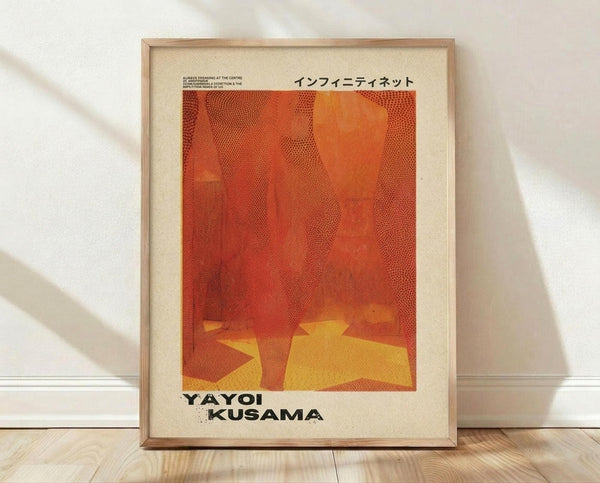 May include: Framed poster with orange and red abstract dotted pattern artwork featuring yellow geometric shapes at bottom, displayed in light wood frame against white wall on wooden floor with soft natural lighting and shadows