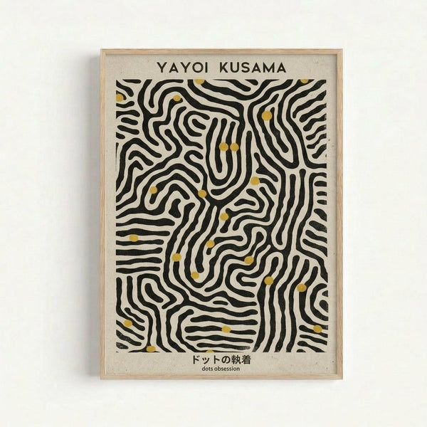 Framed poster featuring abstract black curved lines creating maze-like patterns on cream background, with small yellow dots scattered throughout the design. Text reads "YAYOI KUSAMA" at top and Japanese characters with "dots obsession" at bottom. Light wood frame against white wall.