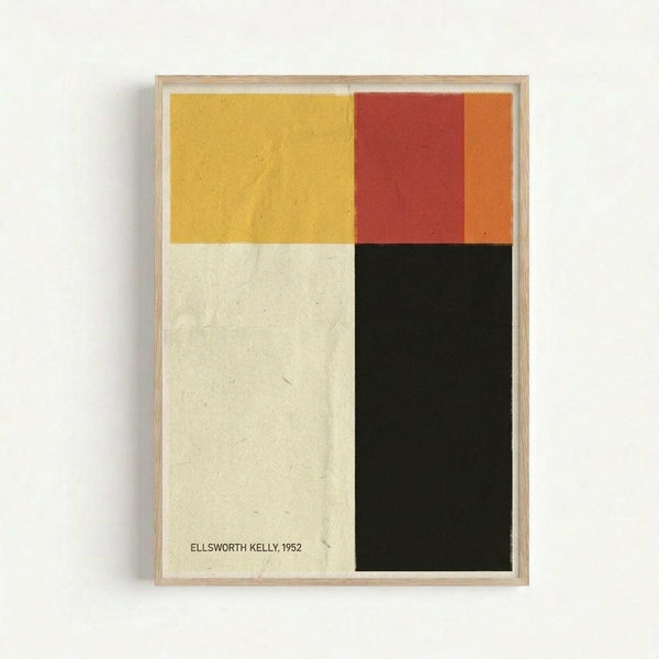 Framed abstract geometric artwork with four color blocks - yellow in upper left, red and orange in upper right, cream/white in lower left, and black in lower right. The piece has "ELLSWORTH KELLY, 1952" printed in small text on the cream section. Set in a light wood frame against a white wall, showing subtle texture and grain in the colored sections.