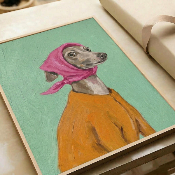 May include: Framed artwork showing an Italian greyhound wearing a pink headscarf and orange sweater against a mint green background, displayed on a white surface next to rolled white paper and cream ribbon