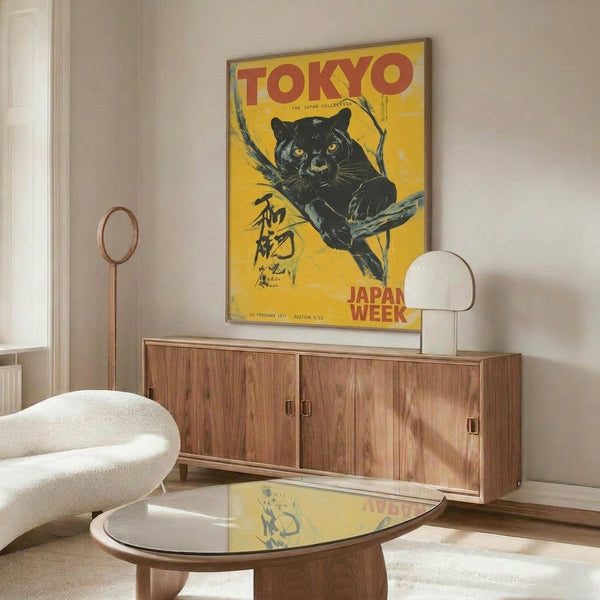 May include: Vintage-style yellow poster featuring a black panther with Japanese text, displayed above a mid-century modern wooden credenza in a contemporary living room. White sculptural chair and glass-top coffee table visible in foreground, with warm natural lighting creating reflections on the glossy surfaces.