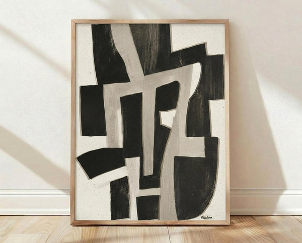 May include: Abstract black and white geometric artwork in light wood frame, leaning against white wall on wooden floor. Bold angular shapes and curved forms create dynamic composition with brushstroke textures. Soft natural lighting creates gentle shadows on textured white wall background.