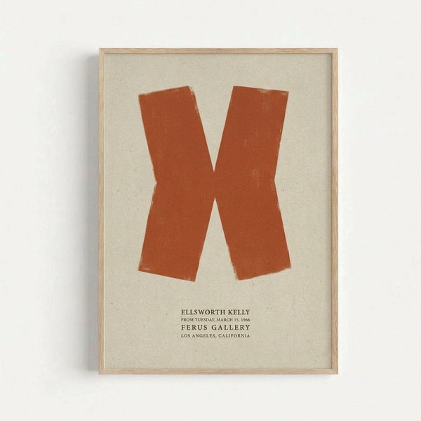 Orange letter X painted in brushstroke style on cream textured background, displayed in light wood frame on white wall. Below the X is black text reading "ELLSWORTH KELLY FROM TUESDAY, MARCH 15, 1966 FERUS GALLERY LOS ANGELES, CALIFORNIA". The artwork has a minimalist, mid-century modern aesthetic with visible paint texture and slightly rough edges on the letterform.