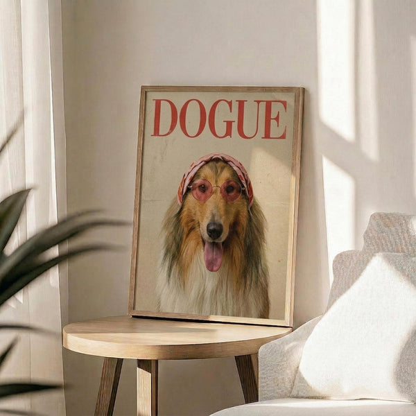 May include: Framed poster featuring a collie dog wearing pink sunglasses and a patterned headscarf with "DOGUE" text in red letters at top, displayed on a round wooden side table next to a beige upholstered chair and plant in bright natural light from nearby window