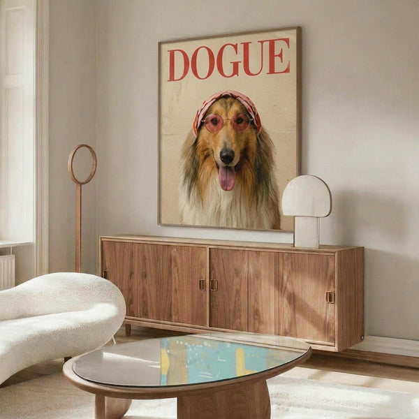 May include: Framed poster print showing a collie dog wearing pink sunglasses and headscarf styled like a vintage fashion magazine cover with "DOGUE" text in red letters, displayed above a mid-century modern walnut credenza with brass hardware in a minimalist living room with white curved chair, oval glass coffee table, and neutral beige walls