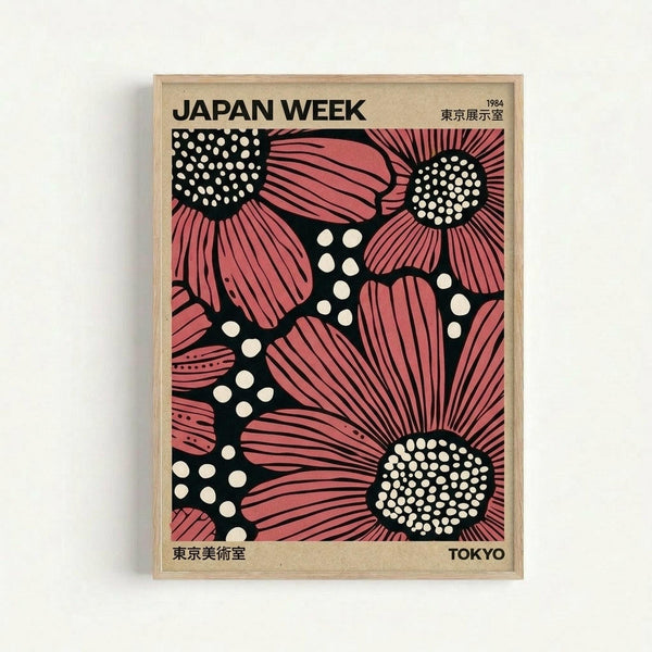 Framed vintage poster featuring stylized pink flowers with black centers filled with white dots against a black background. The design shows large blooms with radiating petals in a bold, graphic style. Text reads "JAPAN WEEK" at top with "1984" and Japanese characters, "TOKYO" at bottom right. Natural wood frame against white wall background.