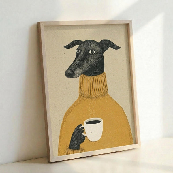 May include: Framed artwork showing a greyhound wearing a mustard yellow ribbed turtleneck sweater, holding a white coffee cup with steam rising. The dog is illustrated in detailed black ink crosshatch style against a cream textured background. Natural wood frame leans against white wall, casting soft shadows.