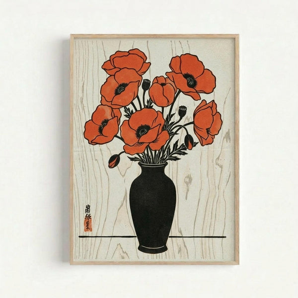 A framed Japanese woodblock print featuring vibrant orange-red poppies in a black vase, displayed against a wood-grain textured background. The artwork shows seven blooming poppies with dark centers and several unopened buds, rendered in traditional ukiyo-e style with bold colors and clean lines. The black vase sits on a dark horizontal line, and red Japanese characters appear in the lower left corner. The print is housed in a light wood frame and photographed against a white wall.