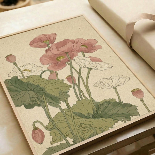 May include: Vintage botanical illustration print displayed on cream colored paper showing pink and white poppies with green stems and leaves. The delicate watercolor-style artwork features blooming flowers and unopened buds against a beige background with visible paper texture. Print appears matted or framed and is photographed alongside neutral fabric ribbon on a soft surface.