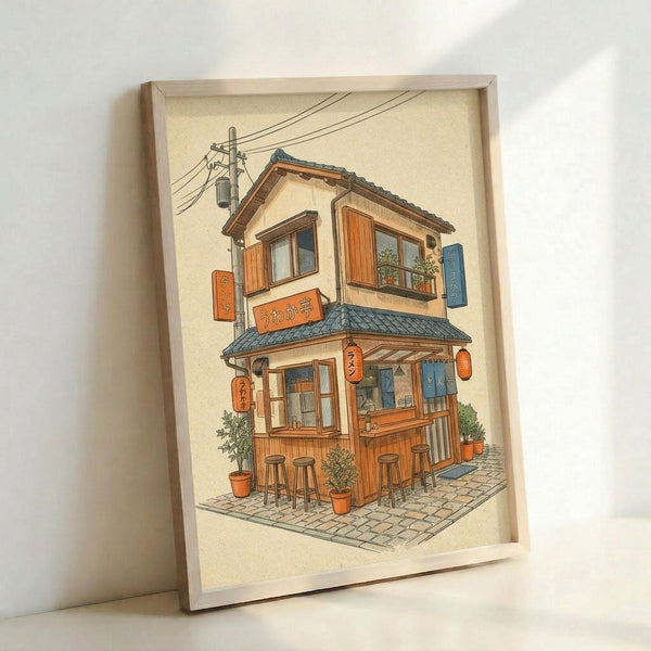 May include: Framed illustration of a cozy two-story Japanese ramen shop with warm orange and brown wooden exterior, blue tile roof, outdoor seating with bar stools, potted plants, hanging lanterns and signs with Japanese text, power lines overhead, displayed in light wood frame against white wall corner