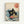 Framed poster print featuring a black cat with yellow eyes eating ramen from a bowl, surrounded by stylized blue and white ocean waves reminiscent of Japanese woodblock art. The cat appears to be slurping noodles while red garnishes float in the bowl. A red circular seal with Japanese characters sits in the upper right corner against the cream-colored background. The artwork combines traditional ukiyo-e wave motifs with whimsical cat illustration in a wooden frame.