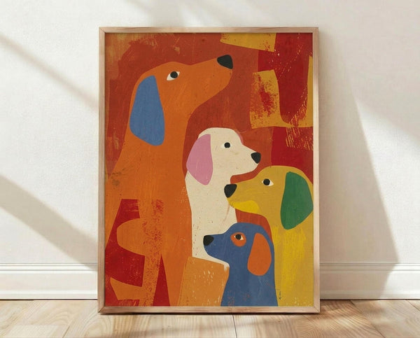 May include: Colorful stylized illustration of four dogs in a thin wooden frame, leaning against a white wall on light wood flooring. The artwork features dogs in vibrant orange, white, yellow, and blue with contrasting colored ears against warm red and yellow geometric background shapes. The print has a textured, painterly quality with visible brush-like effects throughout the composition.