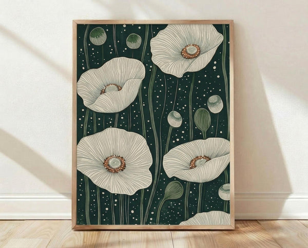 May include: Framed botanical art print featuring white poppies with detailed petal textures and brown centers on dark teal background with white dots. Green poppy buds and stems scattered throughout. Light wood frame displayed against white wall on wooden floor with soft shadows from window light.