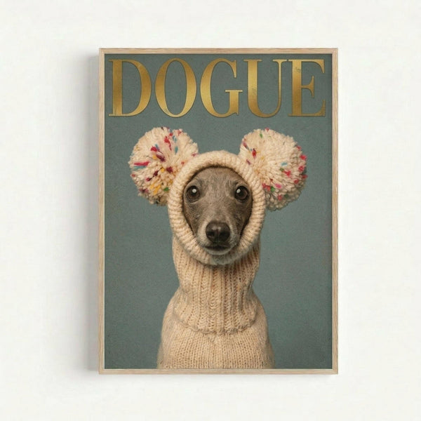Framed poster showing a small gray dog wearing a cream-colored knit sweater and matching hat with colorful pom-pom ears, photographed against a sage green background. Gold text reading "DOGUE" appears at the top in a fashion magazine style. The wooden frame sits against a white wall.