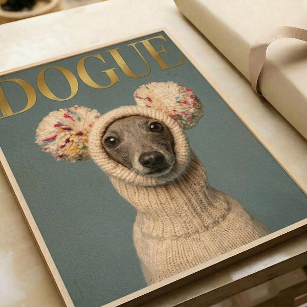 May include: Fashion magazine-style poster print featuring an Italian Greyhound wearing a cream knit sweater and matching pom-pom hat with colorful speckles. The dog sits against a sage green background with gold "DOGUE" lettering at the top. The print is displayed flat on white wrapping paper with cream ribbon nearby, showing the artwork's muted color palette and whimsical portrait photography style.