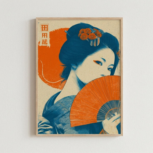 A Japanese-style art print displayed in a light wood frame on a white wall. The artwork features a geisha with dark blue hair adorned with orange flowers, holding a bright orange folding fan that partially covers her face. She wears a blue kimono with wave patterns. The composition uses a limited color palette of orange, blue, and cream with Japanese characters in the upper left corner. The print has a vintage poster aesthetic with visible texture and grain.