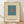 May include: Framed minimalist art print featuring a teal square with small orange square in center on cream background, displayed in light wood frame against white textured wall on wooden floor with soft natural lighting and shadows