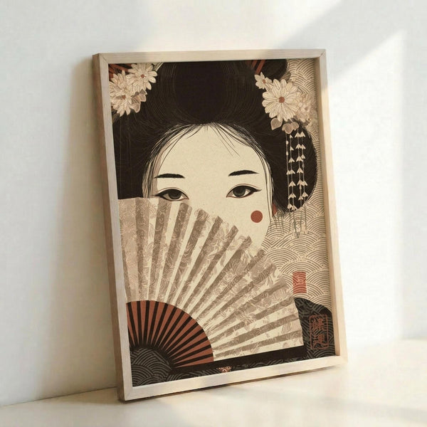 May include: Framed Japanese-style artwork showing a geisha with traditional hair ornaments holding a decorative fan that partially covers her face. The illustration features muted earth tones with intricate wave and floral patterns in the background. The wooden frame leans against a white wall in soft natural lighting.