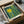 May include: Framed modern art print featuring abstract vertical streaks in teal and yellow with bright yellow sun burst, displayed in black frame inside cardboard shipping box with protective wrapping and tissue paper