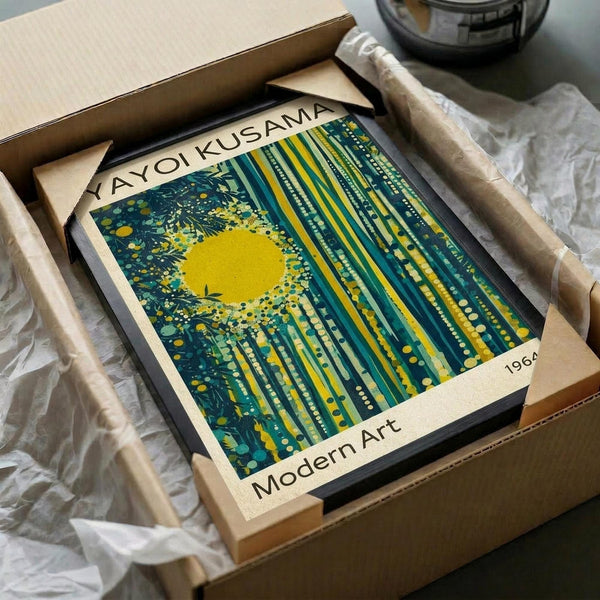 May include: Framed modern art print featuring abstract vertical streaks in teal and yellow with bright yellow sun burst, displayed in black frame inside cardboard shipping box with protective wrapping and tissue paper