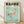 May include: Framed poster with pink flamingo illustration on turquoise background, displayed against white wall on wooden floor. The vintage-style artwork features Japanese text at top, dates showing 2007 exhibition period, and soft watercolor-like flamingo in standing pose. Natural wood frame complements the muted color palette, with soft lighting creating gentle shadows on the wall.