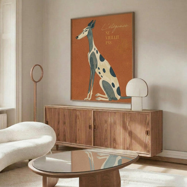 May include: Framed poster featuring an elegant greyhound with spotted coat in cream and teal against terracotta orange background, displayed above mid-century modern walnut credenza in minimalist living room setting with white sculptural chair, glass coffee table, and warm natural lighting