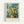 May include: Framed museum poster featuring Van Gogh's yellow chrysanthemums in a brown ceramic vase against swirling blue brushstrokes. Light wood frame with cream matting displays the artwork on a white wall. Text below reads "Vincent van Gogh" and "Van Gogh Museum, Amsterdam" with "Yellow" subtitle. The painting shows vibrant golden blooms with radiating petals and green stems in Van Gogh's distinctive expressive style.